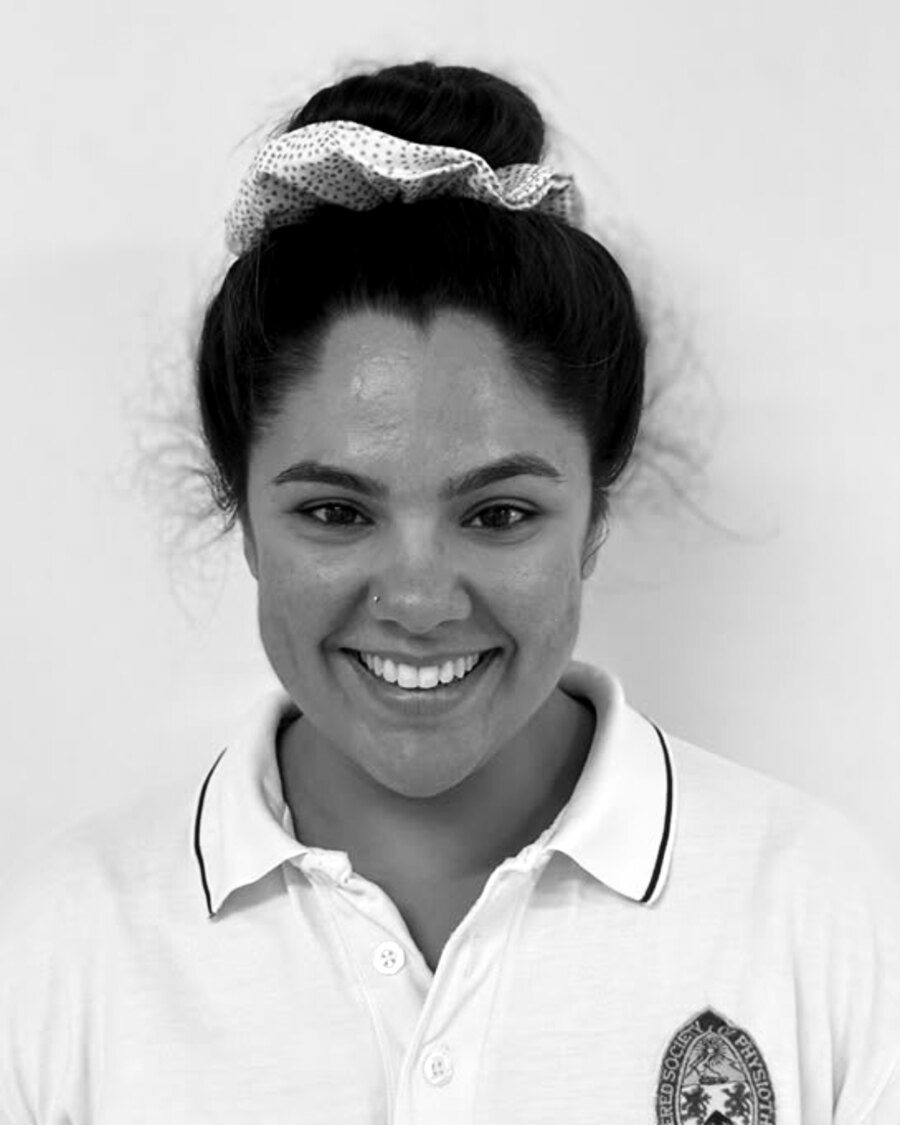 Chantel, physiotherapist, in a Chartered Society of Physiotherapy shirt